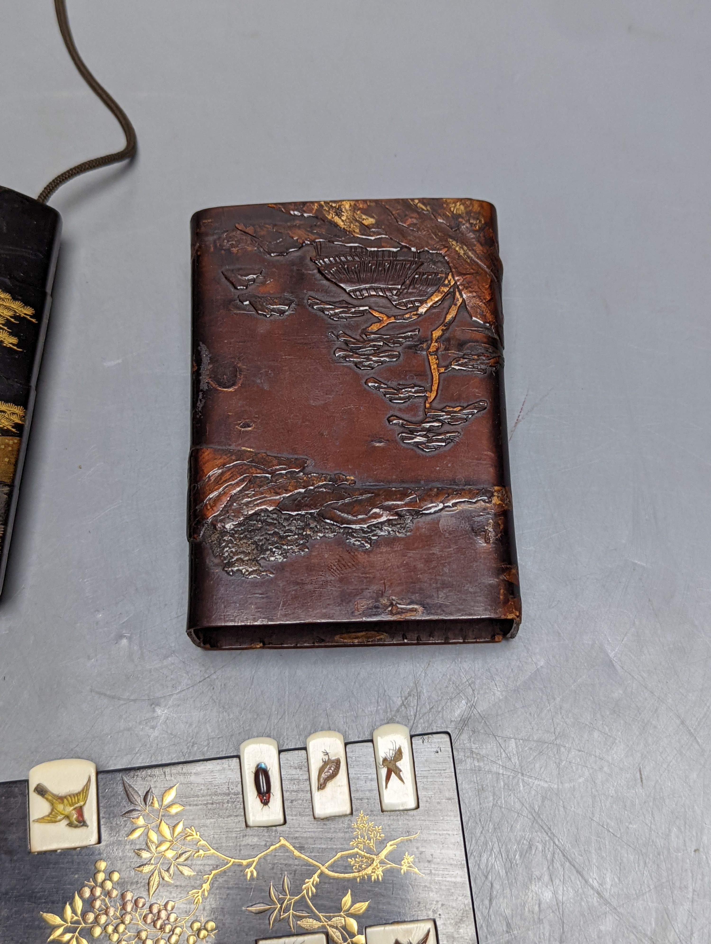 A 19th century Japanese lacquer inro, similar cigar case, two bezique markers and a birch bark case, 9 cams high.